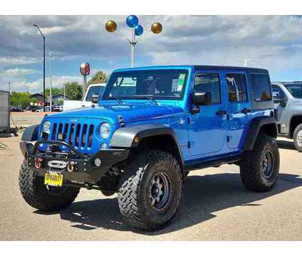 2015 Jeep Wrangler Unlimited Rubicon is a Blue 2015 Jeep Wrangler Unlimited Rubicon SUV in Pueblo CO