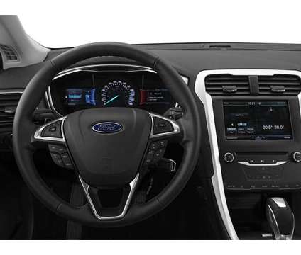 2014 Ford Fusion SE is a Blue 2014 Ford Fusion SE Sedan in Manhattan KS