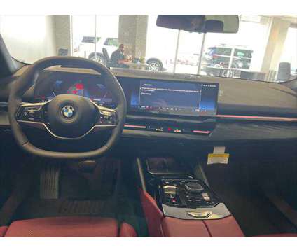 2024 BMW 5 Series i xDrive is a Black 2024 BMW 5-Series Sedan in Dubuque IA
