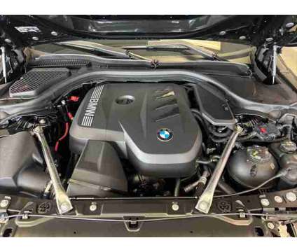 2024 BMW 5 Series i xDrive is a Black 2024 BMW 5-Series Sedan in Dubuque IA