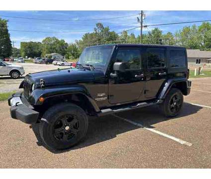2013 Jeep Wrangler for sale is a Black 2013 Jeep Wrangler Car for Sale in Olive Branch MS