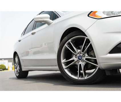 2014 Ford Fusion Titanium is a Silver 2014 Ford Fusion Titanium Car for Sale in Georgetown TX