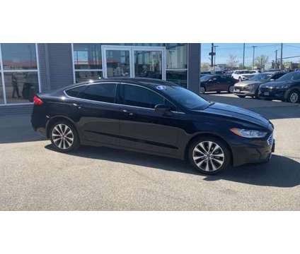 2020 Ford Fusion SE is a Black 2020 Ford Fusion SE Car for Sale in Appleton WI