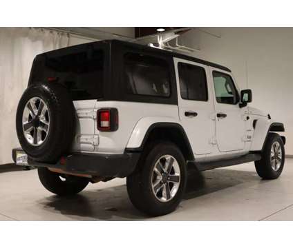 2020 Jeep Wrangler Unlimited Sahara is a White 2020 Jeep Wrangler Unlimited Sahara Car for Sale in Pueblo CO