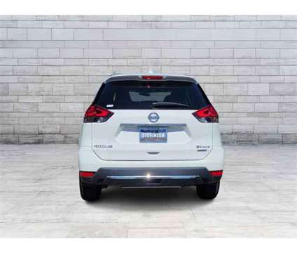 2017 Nissan Rogue SV is a White 2017 Nissan Rogue SV Station Wagon in Longmont CO