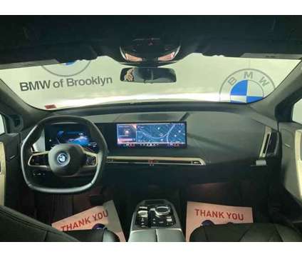 2025 BMW iX xDrive50 is a Black 2025 BMW 325 Model iX SUV in Brooklyn NY
