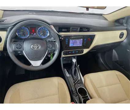 2018 Toyota Corolla LE is a Red 2018 Toyota Corolla LE Sedan in Colonial Heights VA