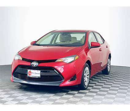2018 Toyota Corolla LE is a Red 2018 Toyota Corolla LE Sedan in Colonial Heights VA