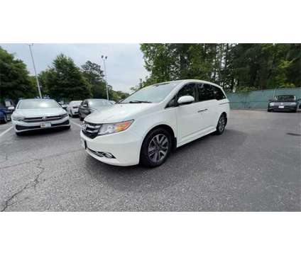 2017 Honda Odyssey Touring is a White 2017 Honda Odyssey Touring Car for Sale in Newport News VA