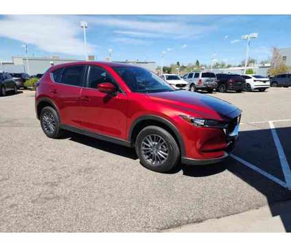 2021 Mazda CX-5 Touring is a Red 2021 Mazda CX-5 Touring SUV in Littleton CO