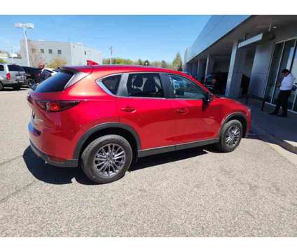 2021 Mazda CX-5 Touring is a Red 2021 Mazda CX-5 Touring SUV in Littleton CO