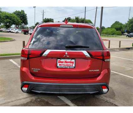 2018 Mitsubishi Outlander LE is a Red 2018 Mitsubishi Outlander LE SUV in Plano TX