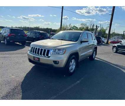 2011 Jeep Grand Cherokee for sale is a Gold 2011 Jeep grand cherokee Car for Sale in Quakertown PA