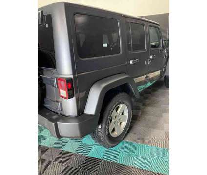 2017UsedJeepUsedWrangler UnlimitedUsed4x4 is a Grey 2017 Jeep Wrangler Unlimited Car for Sale in Brunswick OH