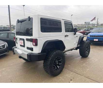 2014 Jeep Wrangler Sahara is a White 2014 Jeep Wrangler Sahara Car for Sale in Des Moines IA