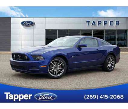 2014 Ford Mustang GT Premium is a Blue 2014 Ford Mustang GT Car for Sale in Paw Paw MI