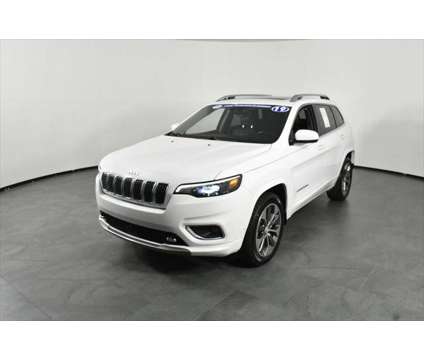 2019 Jeep Cherokee Overland FWD is a White 2019 Jeep Cherokee Overland SUV in Orlando FL