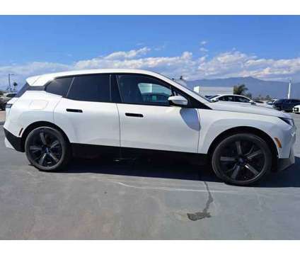 2025 BMW iX xDrive50 is a White 2025 BMW 325 Model iX SUV in Alhambra CA