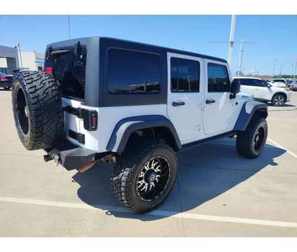 2016 Jeep Wrangler Unlimited Black Bear is a White 2016 Jeep Wrangler Unlimited SUV in Ardmore OK