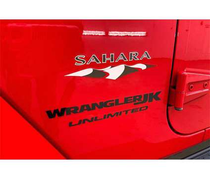 2018 Jeep Wrangler JK Unlimited Sahara is a Red 2018 Jeep Wrangler SUV in Madison WI