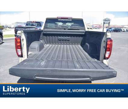 2023 GMC Sierra 1500 4WD Crew Cab Standard Box Elevation is a Tan 2023 GMC Sierra 1500 Truck in Rapid City SD