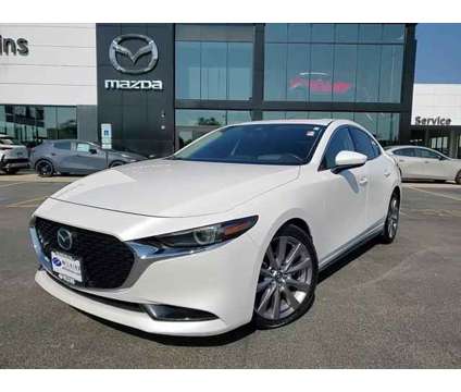 2019 Mazda MAZDA3 Premium Package is a White 2019 Mazda MAZDA 3 sp Sedan in Elmhurst IL