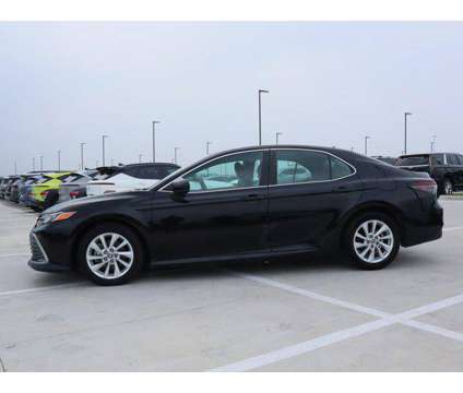 2021 Toyota Camry LE is a Black 2021 Toyota Camry LE Sedan in Friendswood TX