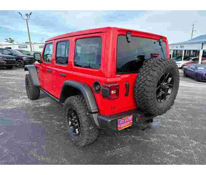 2024 Jeep Wrangler Willys Wheeler is a Red 2024 Jeep Wrangler SUV in Branson MO