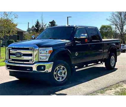2014 Ford F-250SD Lariat is a Blue 2014 Ford F-250 Lariat Truck in Ortonville MI