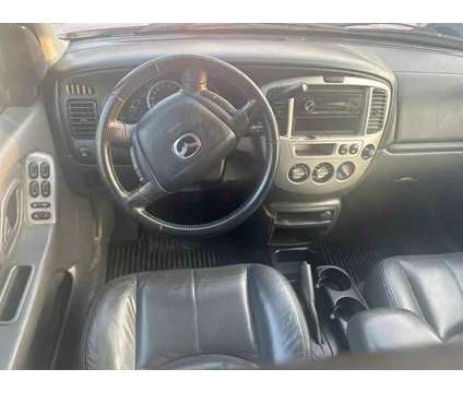 2004 MAZDA Tribute for sale is a Grey 2004 Mazda Tribute s Car for Sale in Houston TX