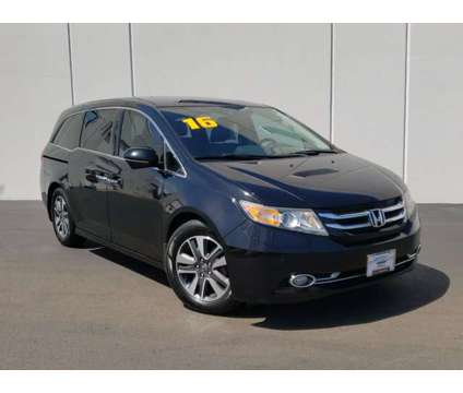 2016 Honda Odyssey Touring is a Black 2016 Honda Odyssey Touring Car for Sale in Waukegan IL