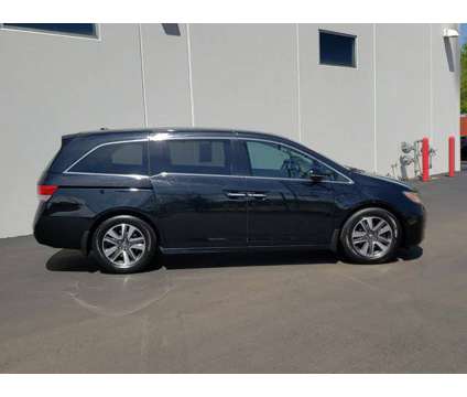 2016 Honda Odyssey Touring is a Black 2016 Honda Odyssey Touring Car for Sale in Waukegan IL