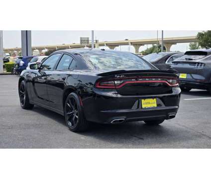 2018 Dodge Charger Sxt is a Black 2018 Dodge Charger SXT Car for Sale in Houston TX