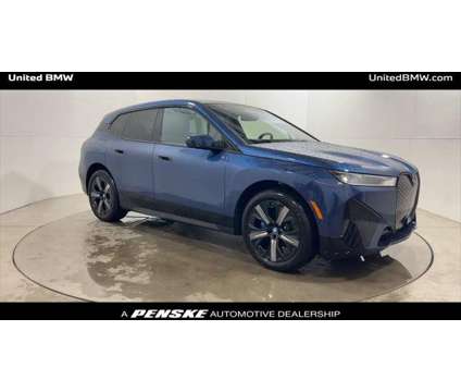 2024 BMW iX xDrive50 is a Blue 2024 BMW 325 Model iX SUV in Alpharetta GA