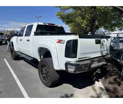 2014 GMC Sierra 2500HD SLE is a White 2014 GMC Sierra 2500 H/D Truck in Logan UT