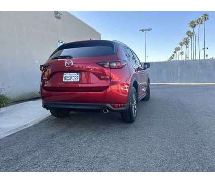 2021 Mazda CX-5 Sport is a Red 2021 Mazda CX-5 Sport SUV in Bakersfield CA