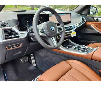 2025 BMW X7 M60i is a White 2025 SUV in Loveland CO