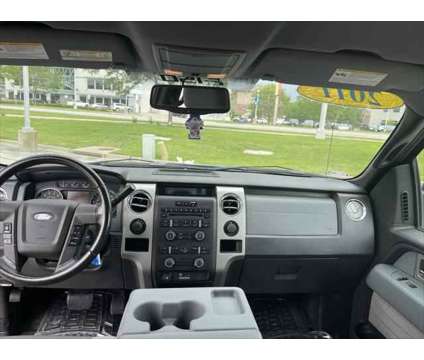 2011 Ford F-150 XLT is a Blue 2011 Ford F-150 XLT Truck in Dubuque IA