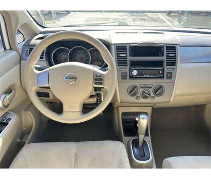 2009 Nissan Versa 1.8 S is a White 2009 Nissan Versa 1.8 S Car for Sale in Springfield VA