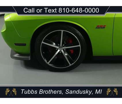 2011 Dodge Challenger SRT8 is a Green 2011 Dodge Challenger SRT8 Coupe in Sandusky MI