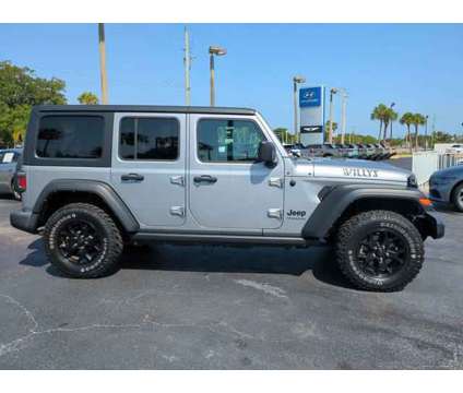 2021 Jeep Wrangler Unlimited Willys 4x4 is a Silver 2021 Jeep Wrangler Unlimited SUV in Daytona Beach FL