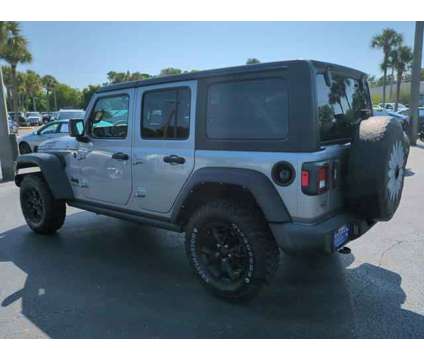 2021 Jeep Wrangler Unlimited Willys 4x4 is a Silver 2021 Jeep Wrangler Unlimited SUV in Daytona Beach FL