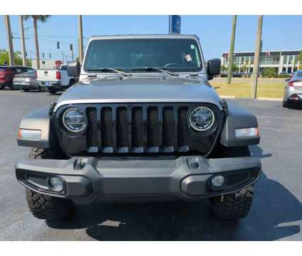 2021 Jeep Wrangler Unlimited Willys 4x4 is a Silver 2021 Jeep Wrangler Unlimited SUV in Daytona Beach FL