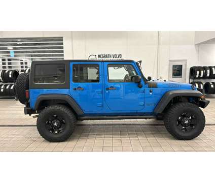 2015 Jeep Wrangler Unlimited Willys Wheeler is a Blue 2015 Jeep Wrangler Unlimited Car for Sale in Barrington IL