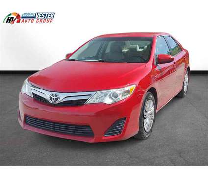 2013 Toyota Camry LE is a Red 2013 Toyota Camry LE Sedan in Wilson NC
