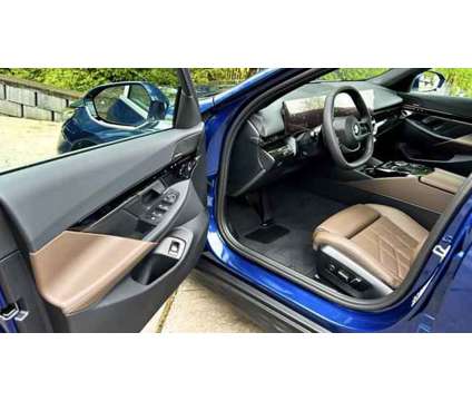 2024 BMW 5 Series i xDrive is a Blue 2024 BMW 5-Series Sedan in Huntington Station NY