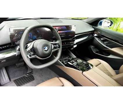 2024 BMW 5 Series i xDrive is a Blue 2024 BMW 5-Series Sedan in Huntington Station NY