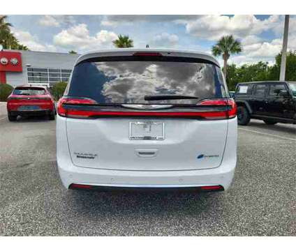 2024 Chrysler Pacifica Hybrid Pinnacle is a White 2024 Chrysler Pacifica Hybrid Hybrid in Orlando FL