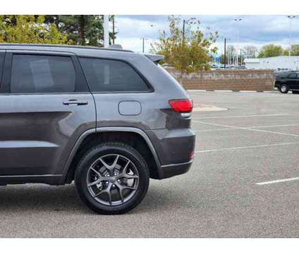 2021 Jeep Grand Cherokee 80th Anniversary is a Grey 2021 Jeep grand cherokee Car for Sale in Denver CO