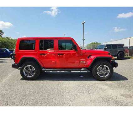2021 Jeep Wrangler Unlimited Sahara is a Red 2021 Jeep Wrangler Unlimited Car for Sale in Orlando FL